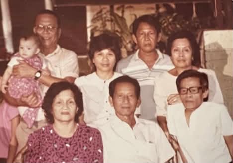 Archival family photo of several generations