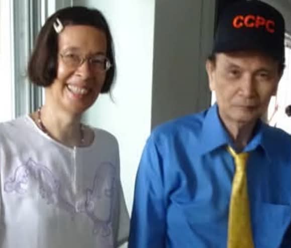 Woman and a man in a CCPC cap posing together