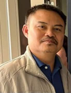Portrait of a man in a beige jacket